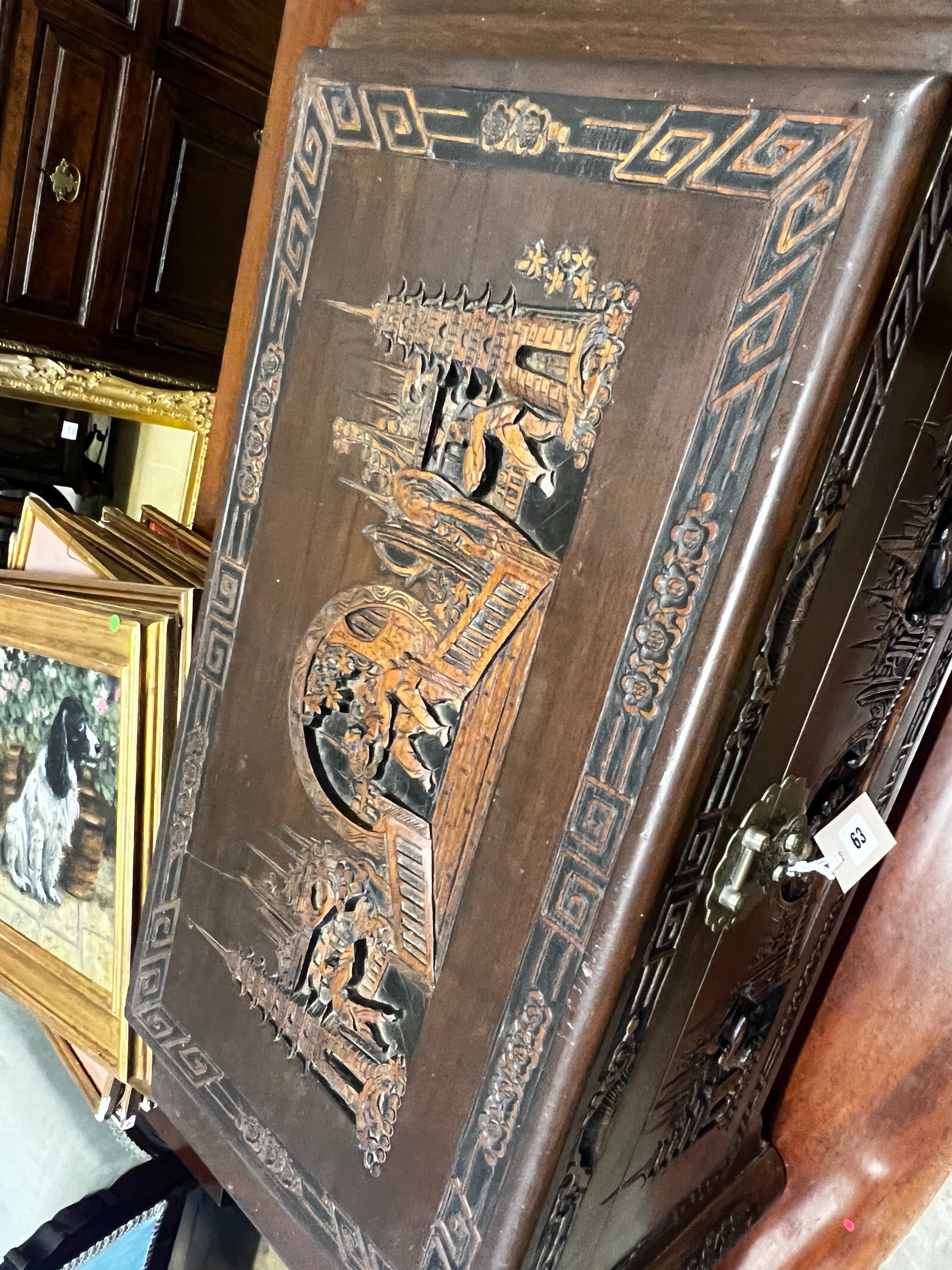 A small Chinese carved camphorwood trunk, length 80cm, depth 38cm, height 40cm